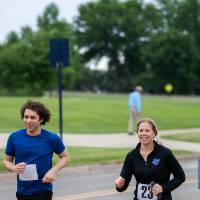 Cameron Jones and Michele Heibel running together and smiling